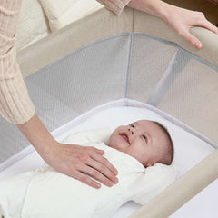 Delta Children Haven AirFlow Bassinet with Breathable Mesh and Wheels, Tan