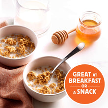 Granola bowls with spoon and honey jar, great for breakfast or a snack