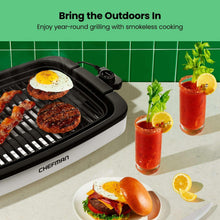 Chefman electric indoor grill with burgers and steak on ridged grates