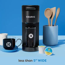 Keurig K-Iced Plus single serve coffee maker in black with iced cup and utensil holder
