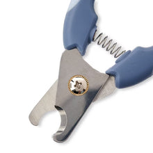 Close-up of blue dog nail clippers showing curved metal cutting blades
