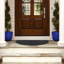 Gray sunburst door mat placed at entryway door, semicircle raised design