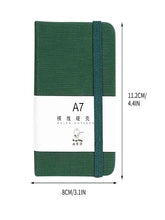Green A7 pocket notebook with hard cover, elastic closure strap, A7 label