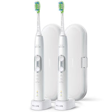 White Philips Sonicare 6100 ProtectiveClean power toothbrushes with charging stand