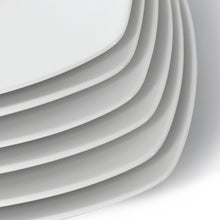 Square porcelain dinner plate, glossy white, curved rim detail
