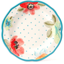 Turquoise-rim dinner plate with teal dot pattern and pink and blue flower accents
