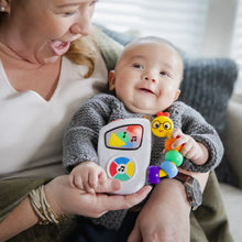 Baby sitting with musical take-along toy, colorful bead chaser, and illuminated screen