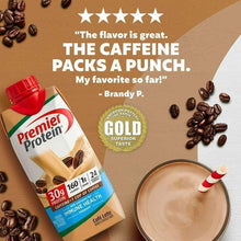 Premier Protein Cafe Latte protein shake carton tilted beside a cup of coffee