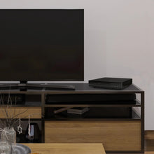 Black HDMI DVD player placed on a media console shelf