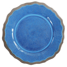 Blue melamine dinner plate with scalloped rim and raised center pattern.