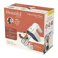 Electric hand mixer box with accessories and compact design