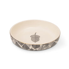 Stoneware low bowl with cream interior and gray leaf emblem, leaf-pattern base