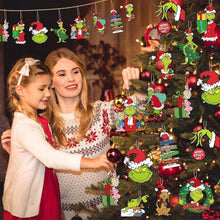 Grinch character hanging Christmas ornaments, colorful cutouts on a tree