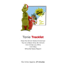 Small green Grinch-style audio play figurine with red gift sack and story card