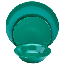Dark green melamine dinnerware set with stacked plates and an empty bowl.