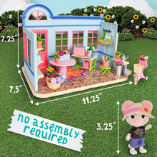 Flower shop dollhouse playset with pink door and windows, outdoor patio furniture