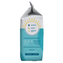 Whole bean coffee bag in white and teal with seal and roast details