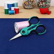 Teal and black precision scissors with comfort grip and fine pointed tip.