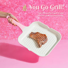 Square grill pan with ridged ceramic nonstick surface holding seared meat
