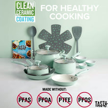 Sage green ceramic cookware set with covered pots, fry pan, and matching serving utensils