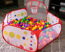 Red-and-white ball pit tent with polka-dot sides and mini basketball hoop