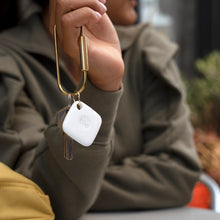 White Tile Mate tracker on keyring with metal keys