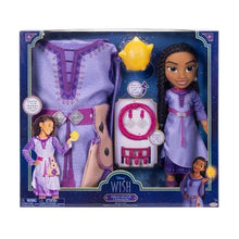 Doll dress-up set in box with lavender dress, doll, and accessories including crown-shaped piece