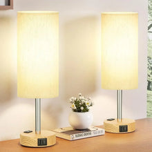 Two touch table lamps with cream fabric shades and wood circular bases with touch panel