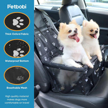 Black paw-print dog car booster seat travel carrier with two small dogs onboard