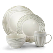 Stoneware dinnerware set with ribbed and dotted plates, bowl, and mug, white
