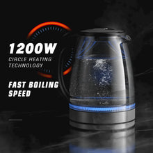 Electric glass kettle with blue-lit heating ring and black top lid