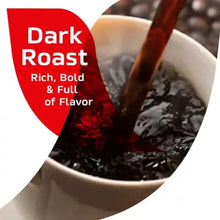 Instant coffee grounds in a cup with a dark spoon and red promotional shape