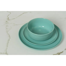 Seafoam green stoneware dinner plate with matching bowl and shallow bowl