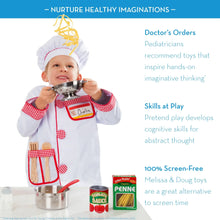 Kids chef holding stainless pot with colander in play kitchen outfit