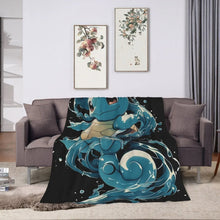 Black flannel throw blanket with centered teal-blue turtle character wave graphic