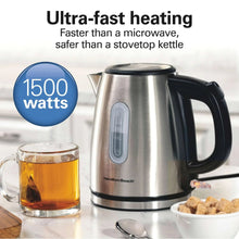 Stainless steel electric kettle with black handle, viewed from front-right angle