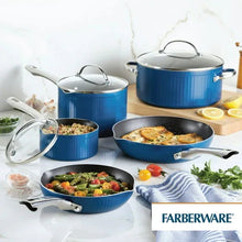 Blue nonstick cookware pieces: covered saucepans, skillet, and dutch oven with lids