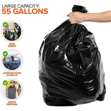Black 55-gallon trash bag held by the top, crinkled heavy-duty plastic