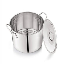Stainless steel stock pot interior with metal lid and side loop handles