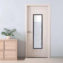 Black framed rectangle wall mirror centered on light door.