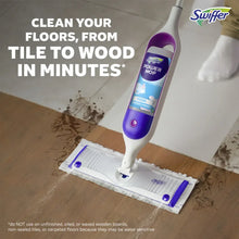 Swiffer Power Mop mopping device cleaning a tile and wood floor with pad