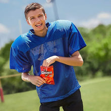 Doritos snack chip bag held outdoors by a person