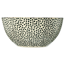 Stoneware serving bowl with black and white dotted pattern medallion