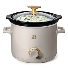Taupe manual slow cooker with black lid, gold knob, and front dial