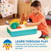 Toddler plastic sink set with dishes, soap dispenser, and a child playing