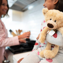 White Tile Mate tracker attached to a plush teddy bear