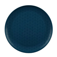 Navy plastic dinner plate with repeating leaf-and-vine pattern across surface