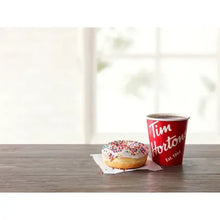 Tim Hortons dark roast coffee cup with donut on a plate
