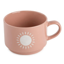 Ceramic coffee mug in dusty pink with sun icon design and side handle