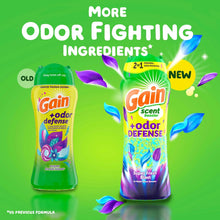 Laundry scent booster beads bottles, green and purple labels comparing formulas